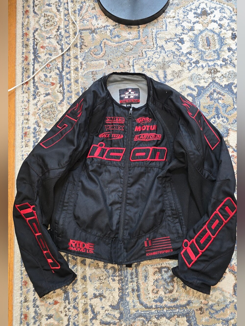 ICON Black Performance Motorcycle Jacket with Red Logos